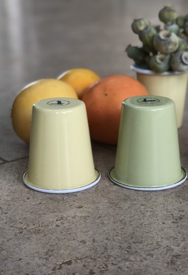 small pale green and lemon enamel tumblers