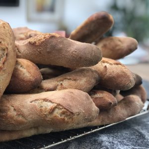 fresh homemade baguettes piled up